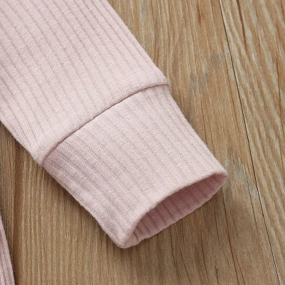 barboteuse bébé fille rose poignet