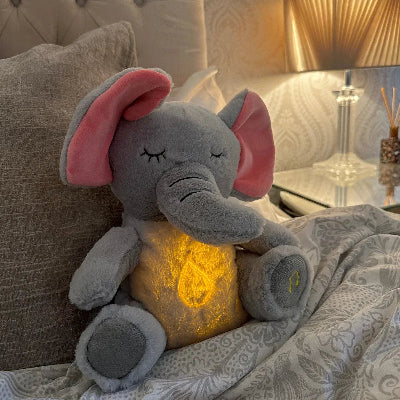 peluche bebe éléphant transforme les nuits