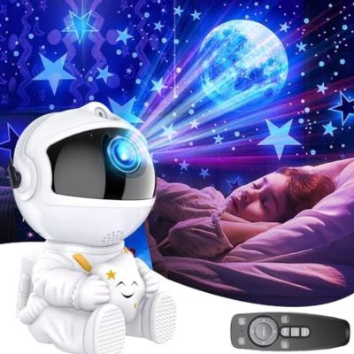 veilleuse projection astronaute blanc Project sur le plafond un spectacle céleste apaisant dans la chambre de petite fille qui dors sur son lit