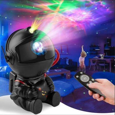 veilleuse projection astronaute noir Project sur le plafond lumière galaxie colore avec un enfant qui lève la main au plafond 